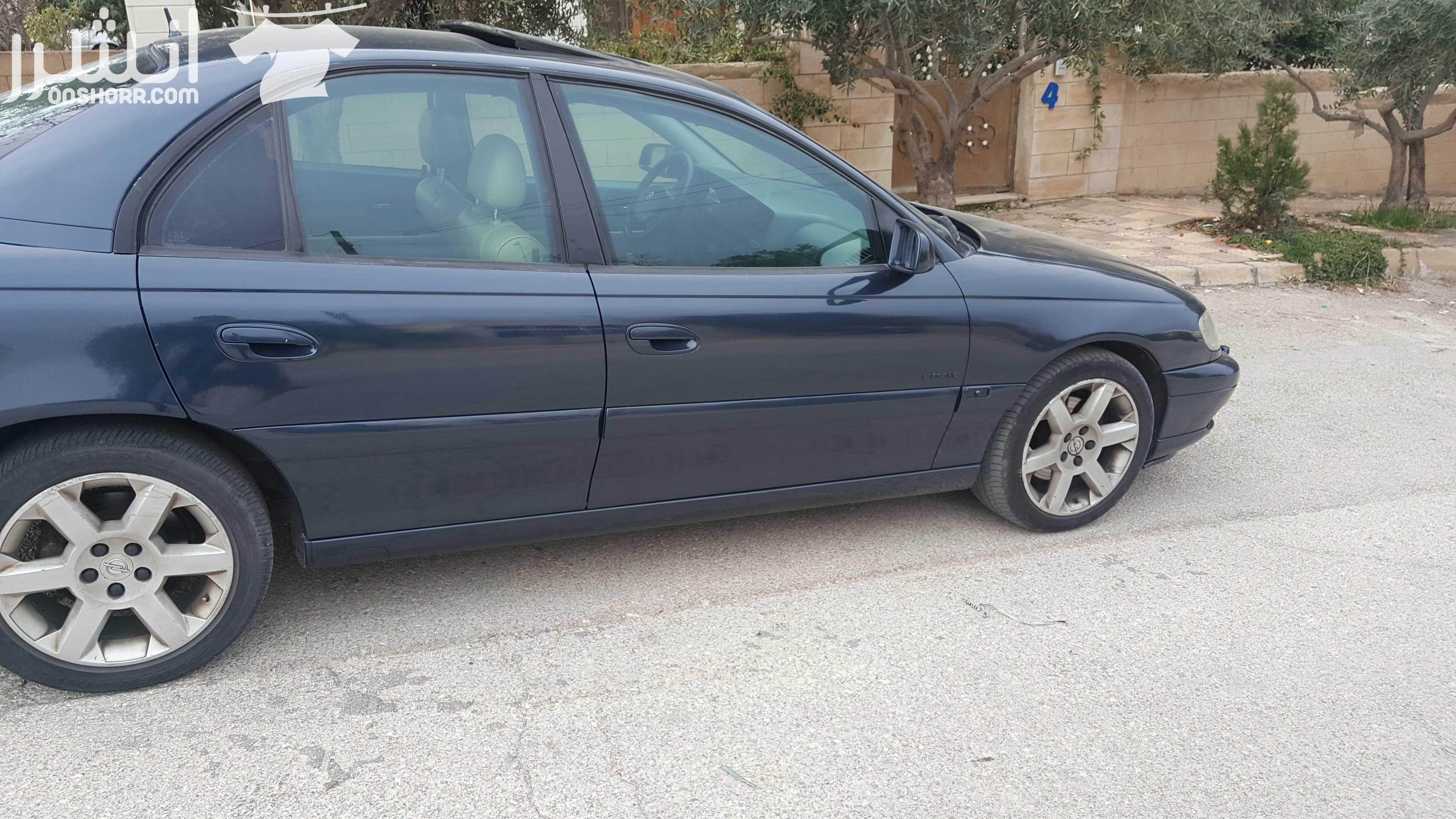 اوبل اوميغا موديل 2003 لون كحلي 2200سي سي ،جنط 17 اصلي، فتحة، حساسات خلفية اصلية، مثبت سرعة، مسجل philips مع سي دي تشينحر اصلي، تحكم طارة، اضوية زنون، نظام امان للاطفال و السرقة، فرش جلد، كراسي كهرب...