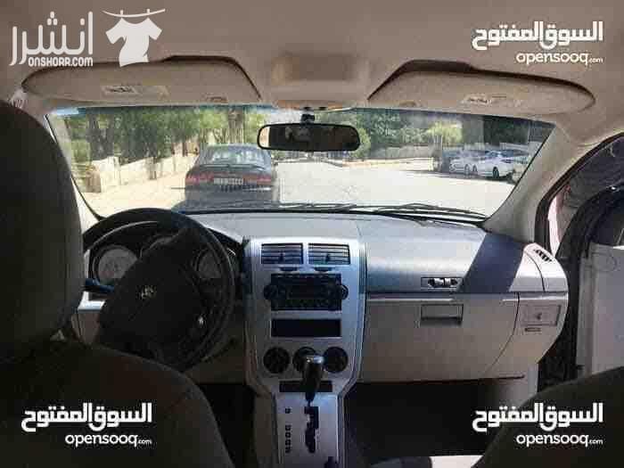 دودج كالبر الفحص 4 جيد ماتور 2000 سي سي جير اوتوماتيك لون فيراني مميز وضع السيارة توب نظافة صيانة كاملة من زيوت فلاتر بركات بواجي هيئة امامية خلفيو من صنوبرصات و كفات و عمدان توازن و جلود (لا...